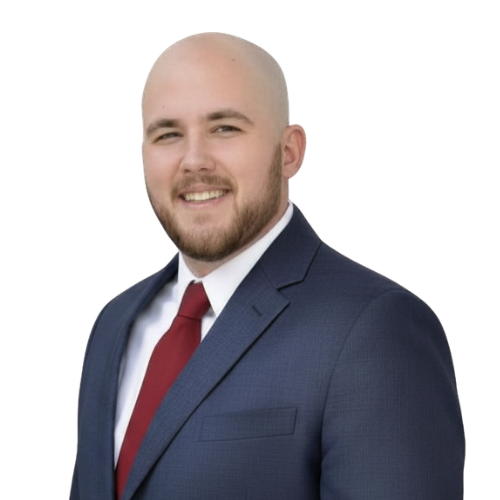 Professional headshot of attorney Carson R. Hicks wearing a navy suit, white dress shirt, and red tie, smiling against a light background.